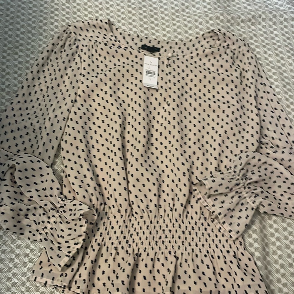 Ann Taylor cream blouse. Peplum waist. Great fit. Size small. NWT.